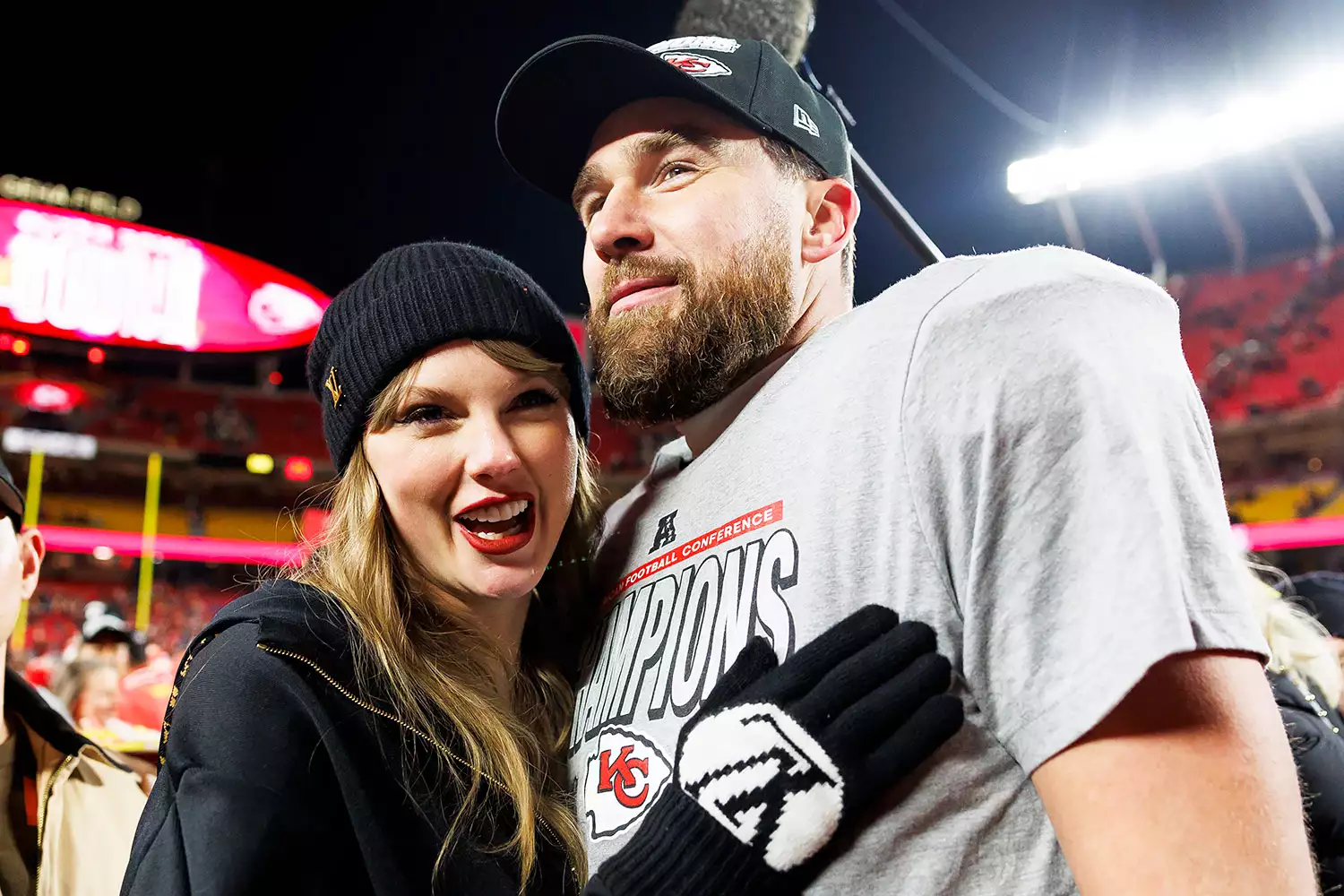 Tight end Travis Kelce #87 of the Kansas City Chiefs celebrates with Taylor Swift after the AFC Championship football game against the Buffalo Bills, at GEHA Field at Arrowhead Stadium on January 26, 2025 in Kansas City, Missouri