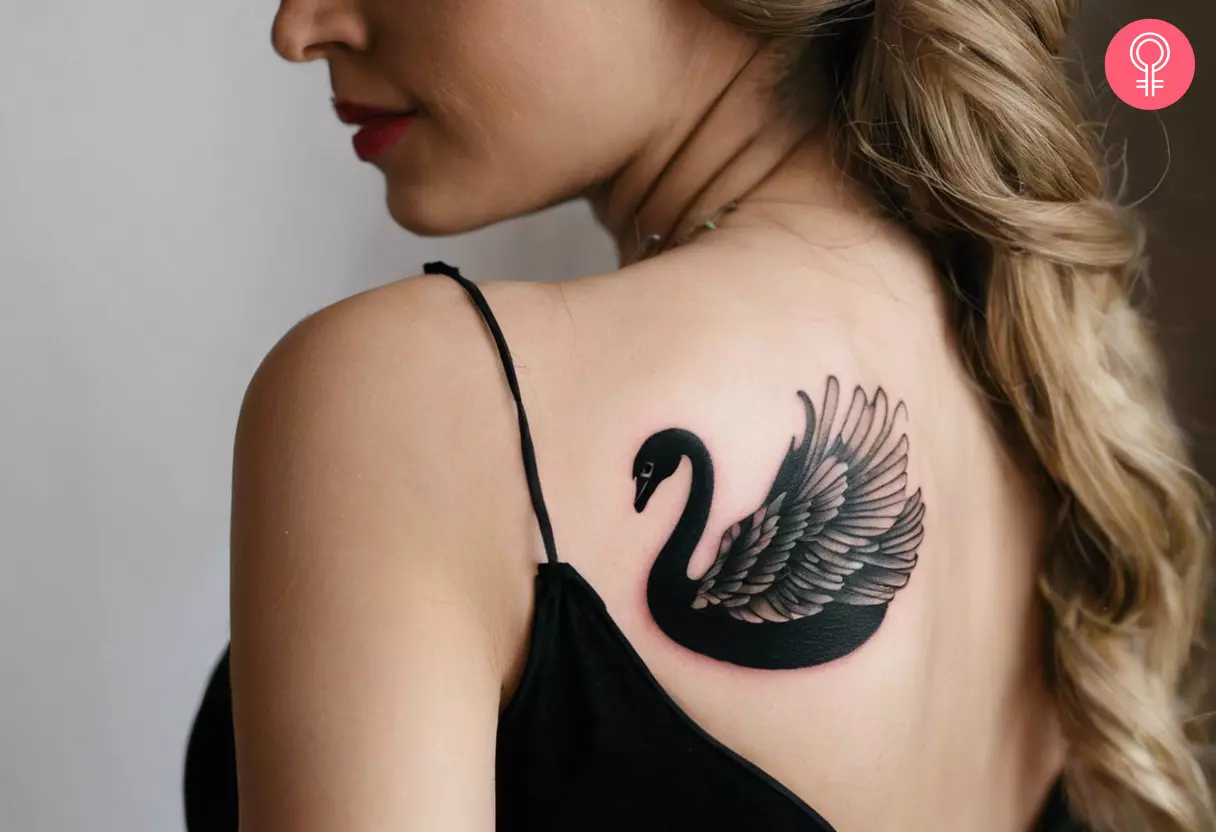 Black swan tattoo on the back