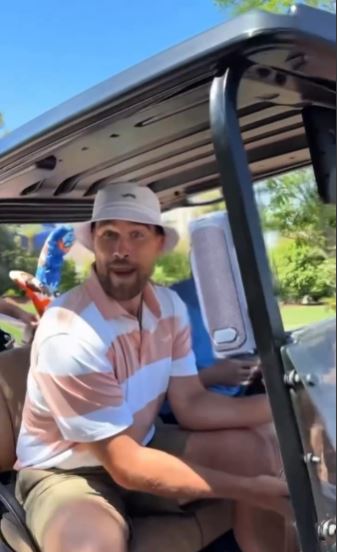 JT Kelce in a golf cart.