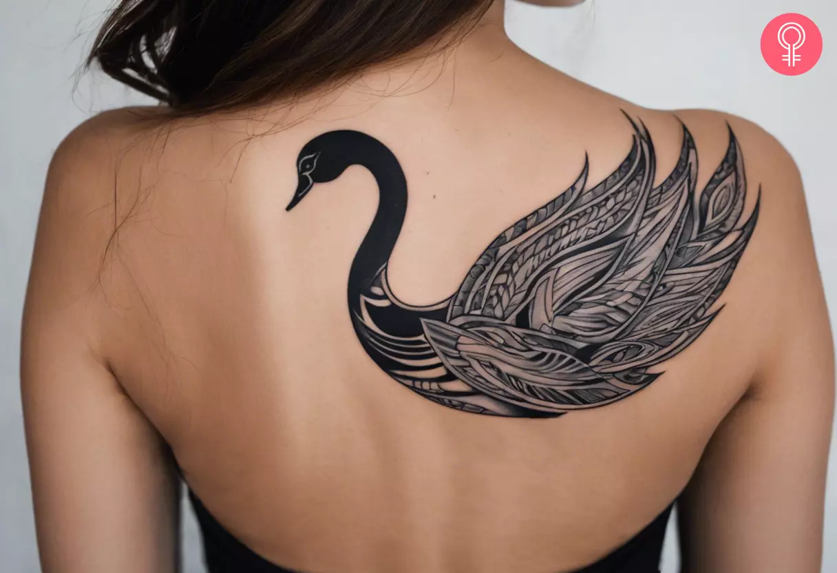 Tribal swan tattoo on the back