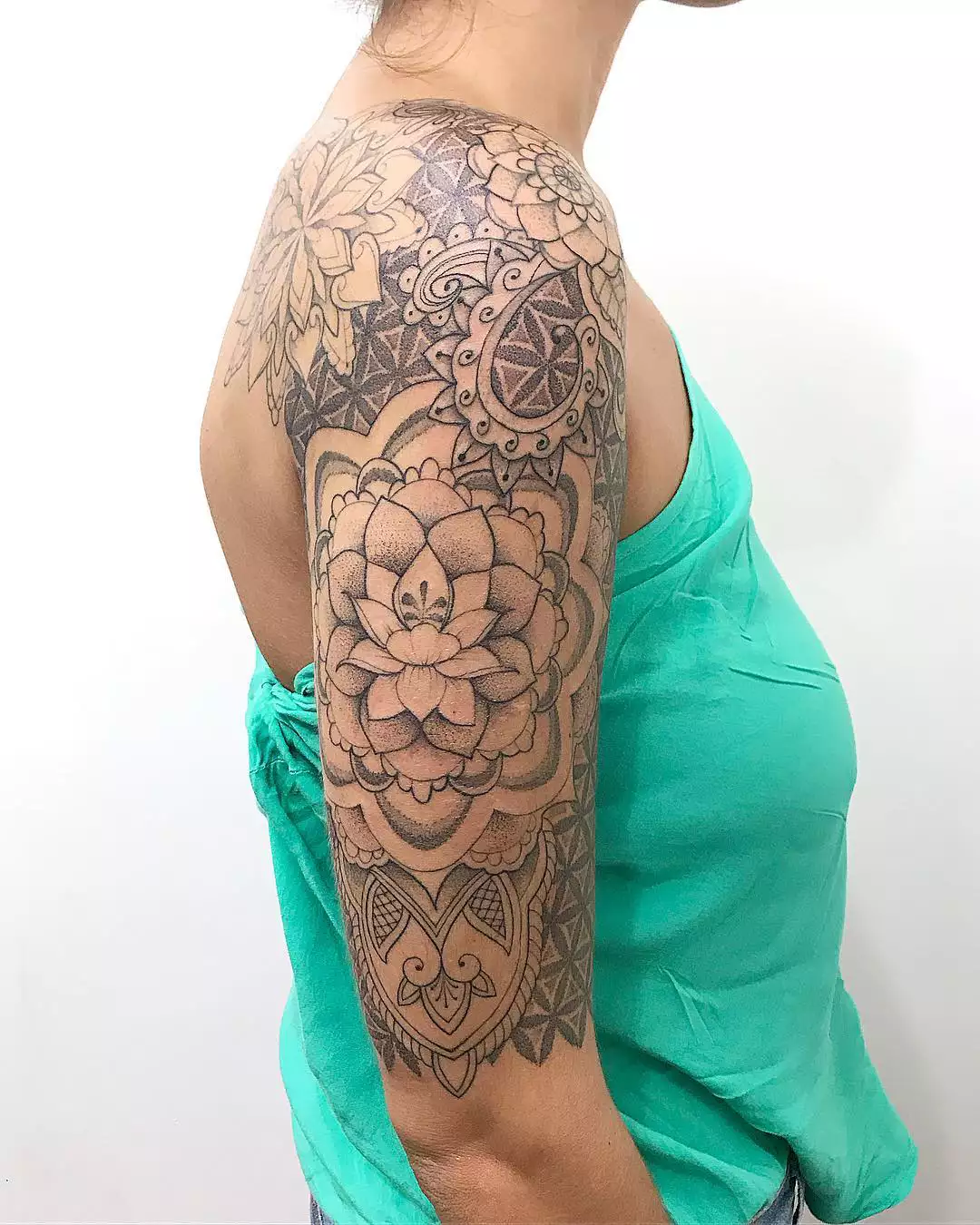 Image of a blackwork lotus flower tattoo design on the arm