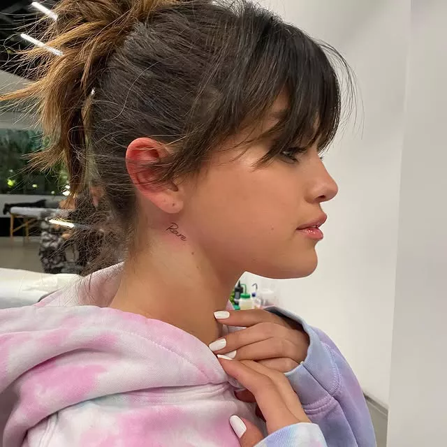 Side view of Selena Gomez's tiny neck tattoo, Rare.